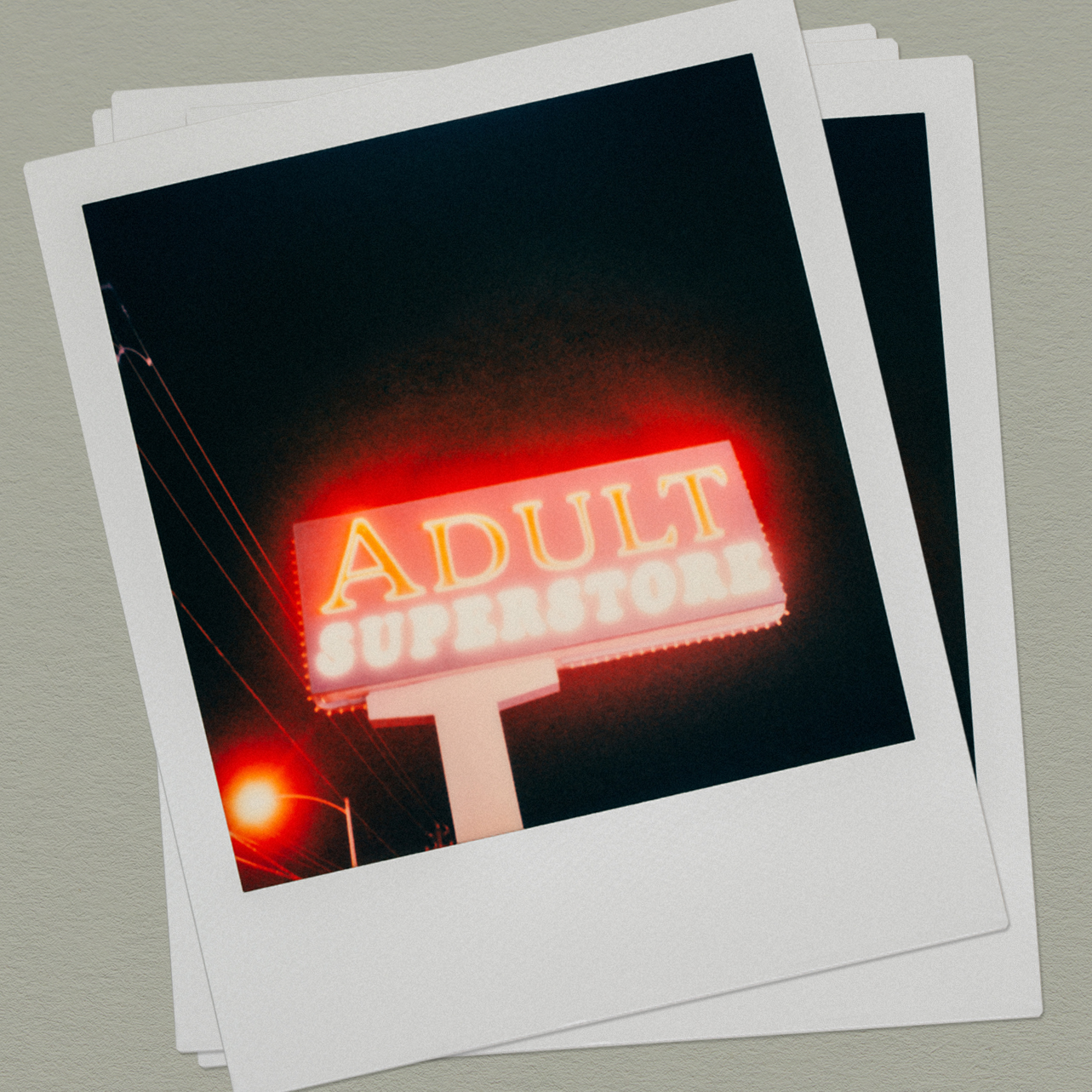 Adult Superstore Sign At Night Shot On Polaroid Long exposure, shot at night on a vintage SX-70 Land camera.