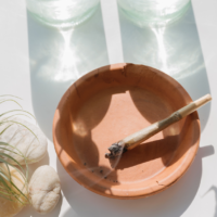 Cannabis joint burning in an ashtray