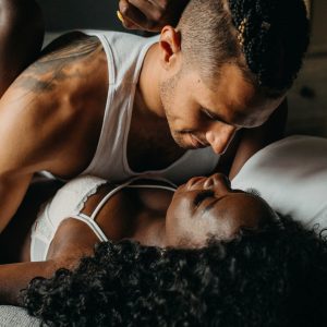 black woman and white man in bed demonstrating sexual compatibility