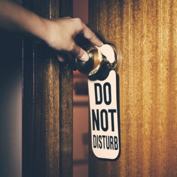 Do Not Disturb Sign Hanged On A Knob