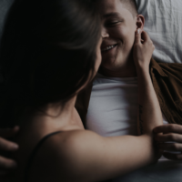 face sitting, couple in bed