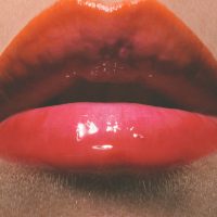 Sensual glossy lips in close-up.