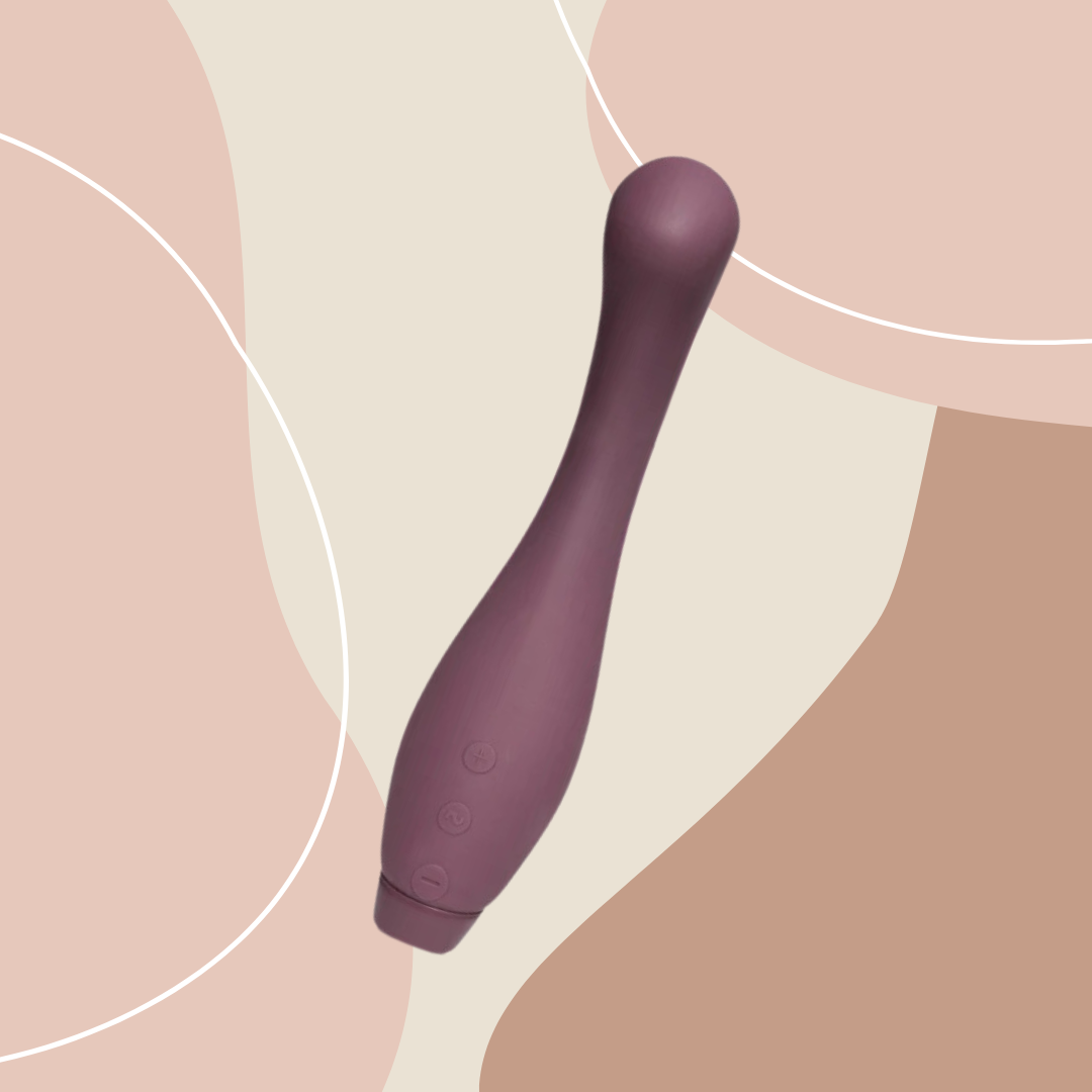 Purple Je Joue Juno Vibrator on pink/brown abstract shape background