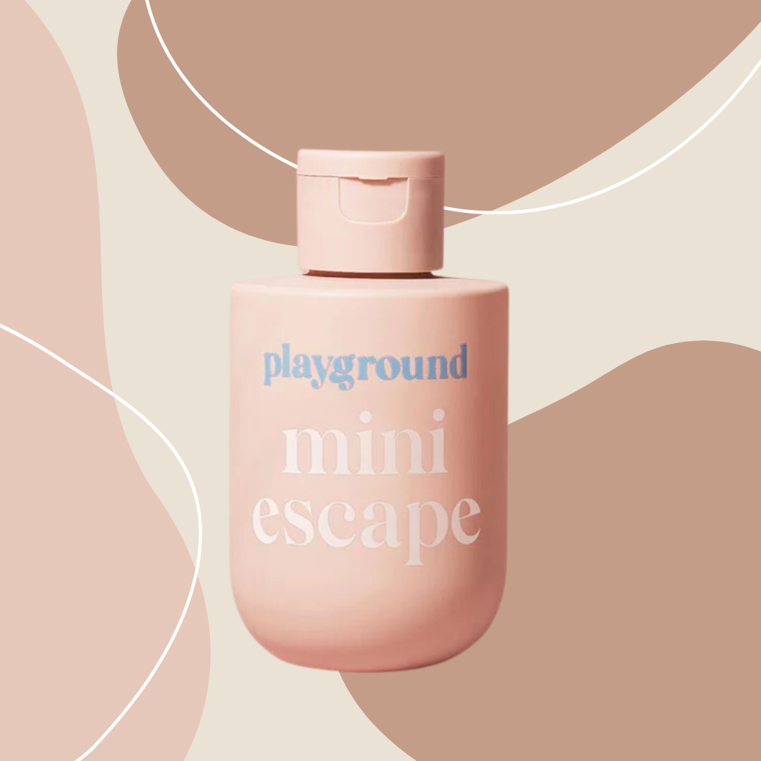 Playground Mini Escape Lube on pink/brown abstract shape background