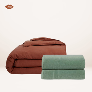 Brooklinen Washed Duvet Set and Super Plush Towels on pale background with SWE lips logo in upper right corner