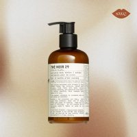 Le Labo Lotion on gold background with SWE logo in upper right corner