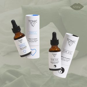 TONIC OG and Chill CBD drops on green bed background