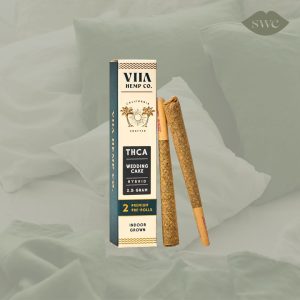 VIIA Hemp Co. Wedding Cake pre rolls on green bed background