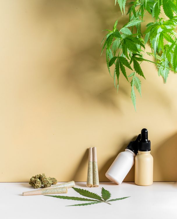 CBD Oil Stock Photo. CBD oil, weed, cannabis leaf, and pre-rolled joints. A legal drug used to relax and relieve stress.