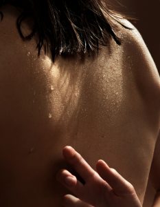 Young woman's nude back