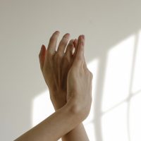 Woman's hands over white background