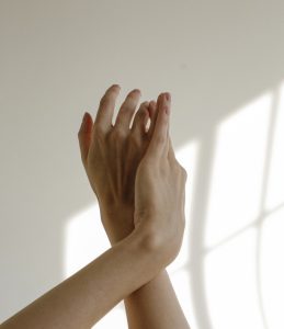 Woman's hands over white background