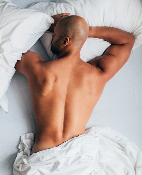 young man lying in the bed, sleeping